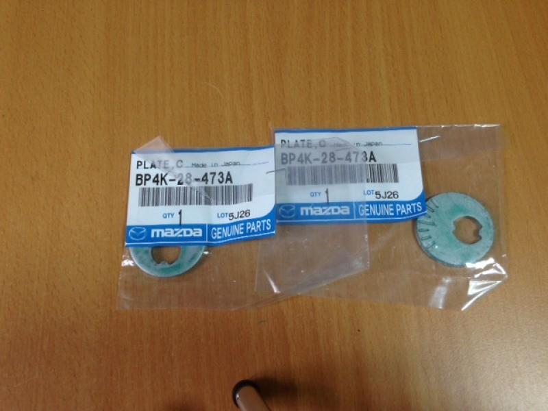 BP4K28473A Mazda Podkładka śruby mocowania tylnego wahacza dolnego, wewnętrzna