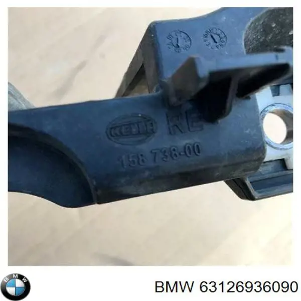 63126936090 BMW wspornik (adapter mocowania reflektora przedniego prawego)