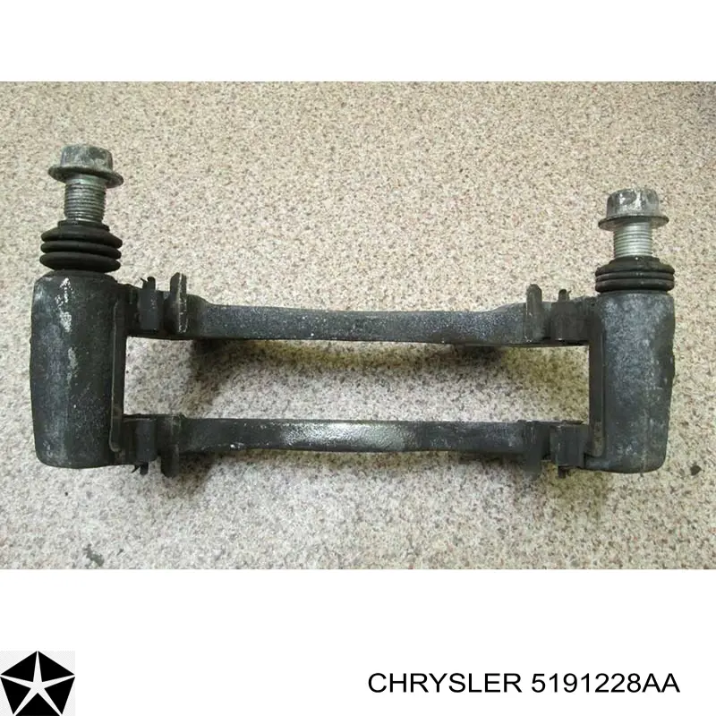 Do koszyka 5191228AA Chrysler Jarzmo zacisku hamulcowego przedniego