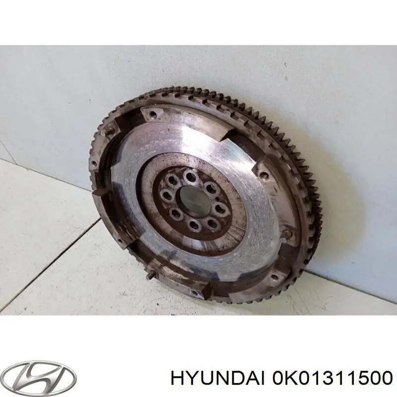 Do koszyka 0K01311500 Hyundai/Kia Koło zamachowe silnika