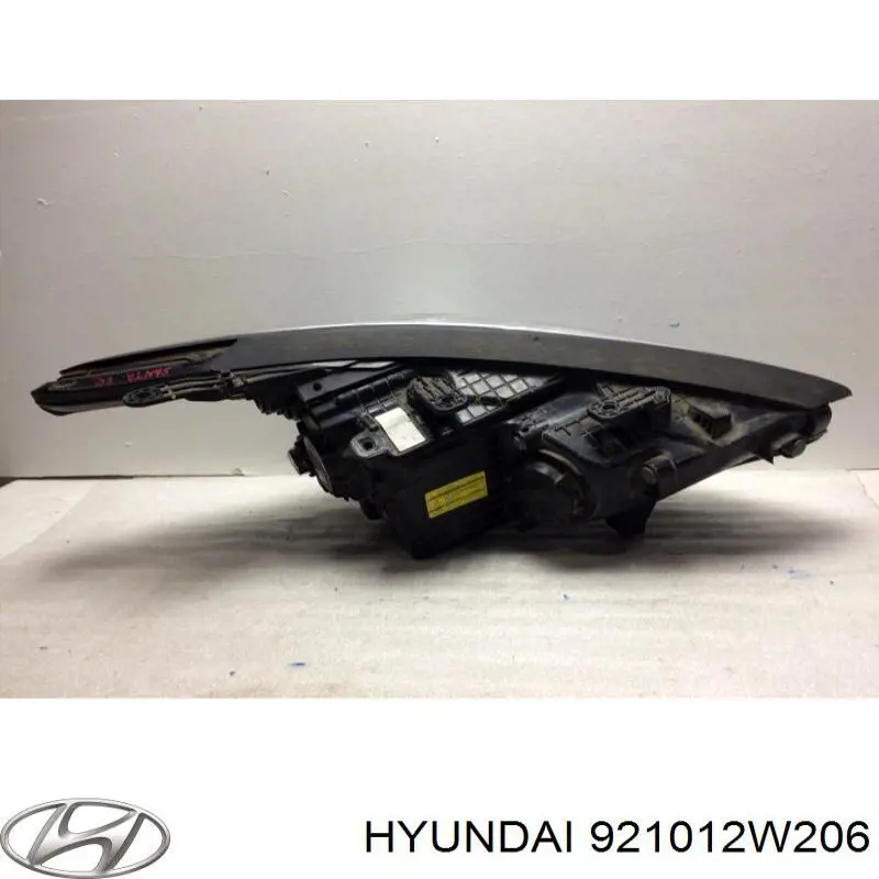 Do koszyka 921012W206 Hyundai/Kia Reflektor lewy