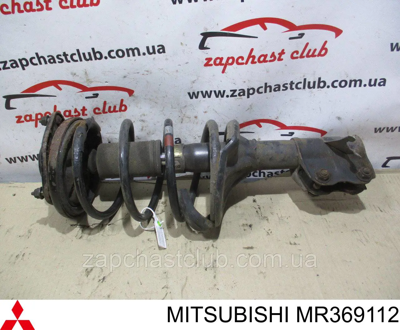 Do koszyka MR369112 Mitsubishi Amortyzator przedni lewy
