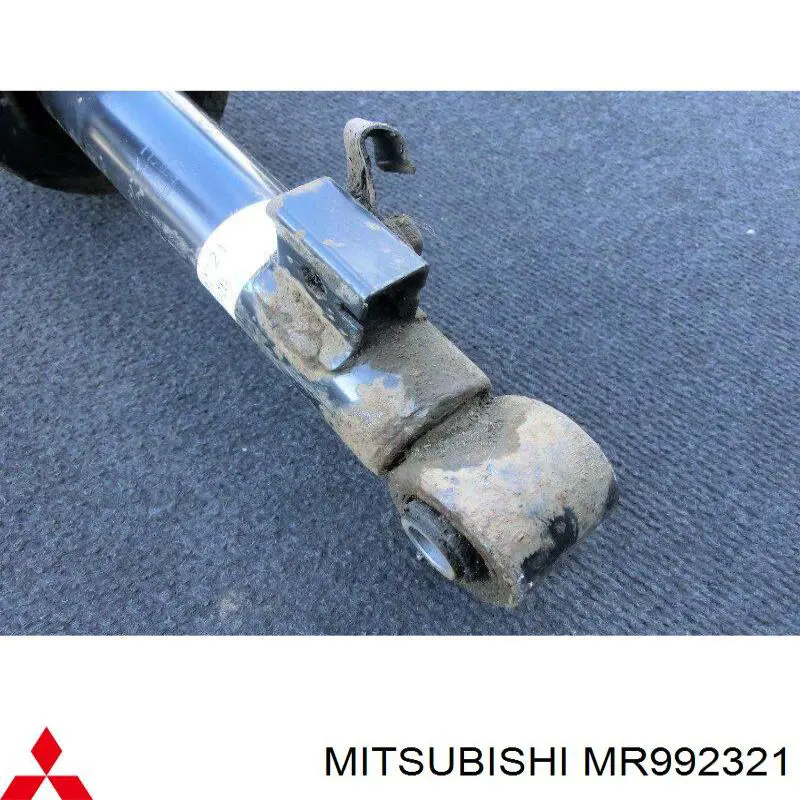 Do koszyka MR992321 Mitsubishi Amortyzator przedni