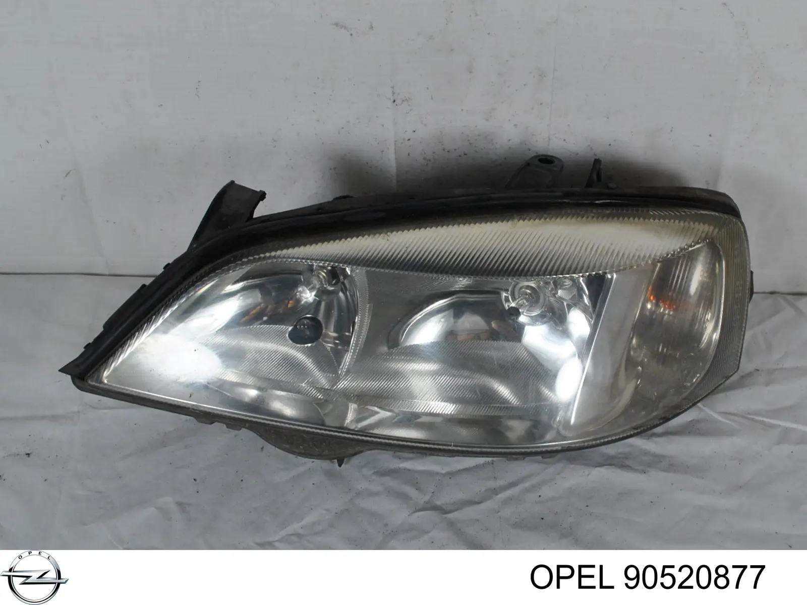 90520877 Opel Reflektor lewy