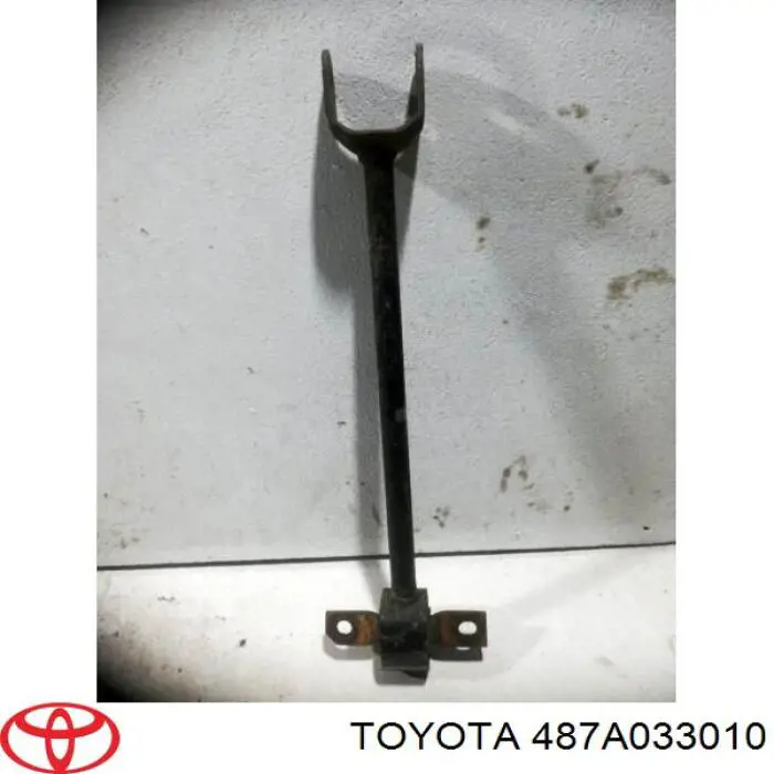 487A033010 Toyota Drążek podłużny zawieszenia tylnego lewy