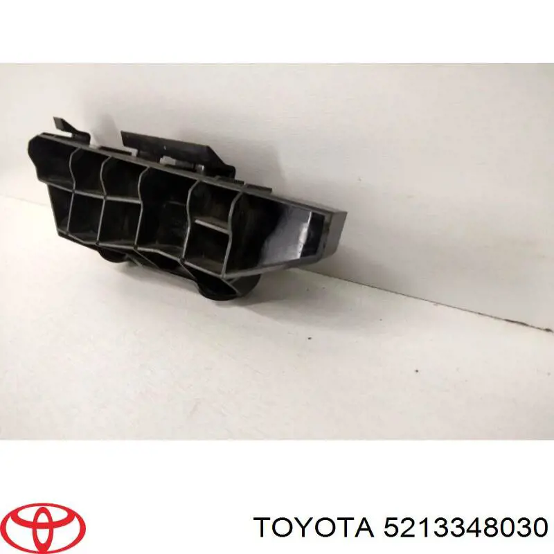 5213348030 Toyota Wspornik (adapter) mocowania reflektora przedniego prawego