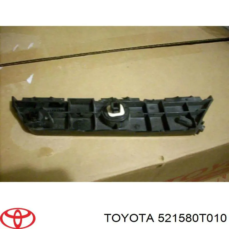 521580T010 Toyota Wspornik zderzaka tylnego lewy zewnętrzny