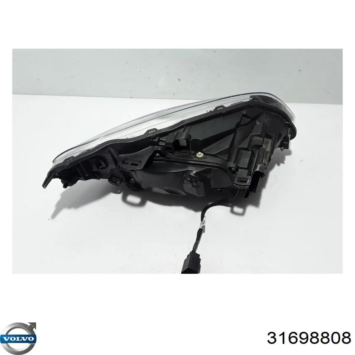 Reflektor lewy 31698808 Volvo