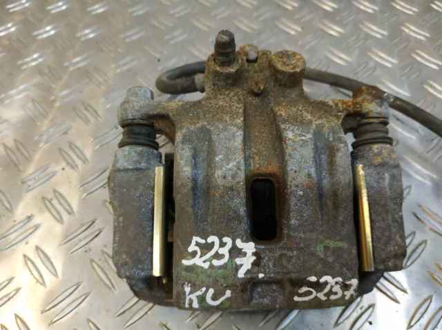 Zacisk hamulcowy tylny lewy L20626990C MAZDA