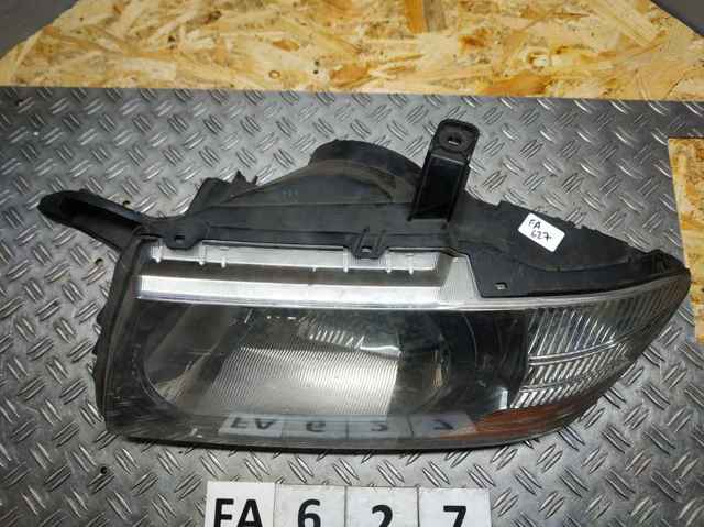 Reflektor lewy MN133753 MITSUBISHI