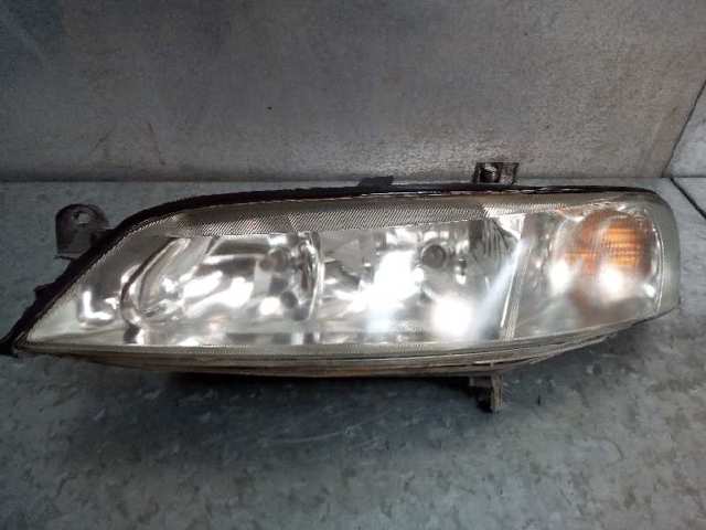 Reflektor lewy 09119523 OPEL