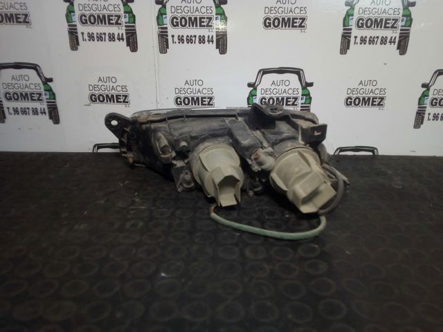 Reflektor lewy Mazda 323 BA