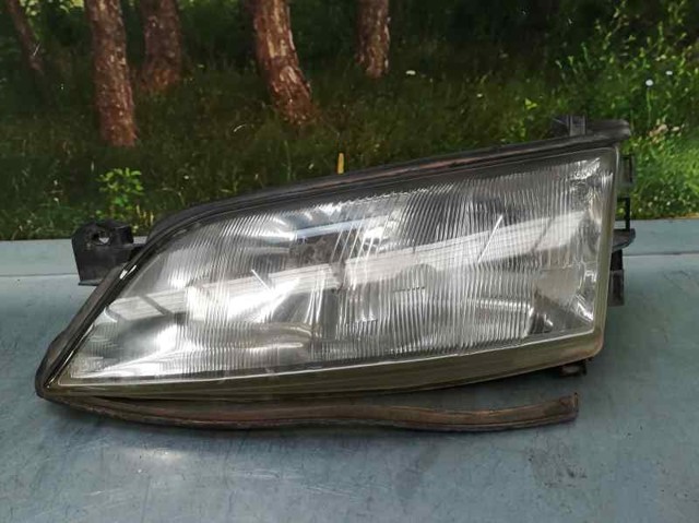 Reflektor lewy 1216011 OPEL