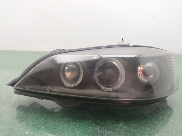 Reflektor lewy 13132455 OPEL
