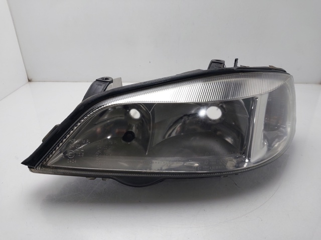 Reflektor lewy 13132459 OPEL