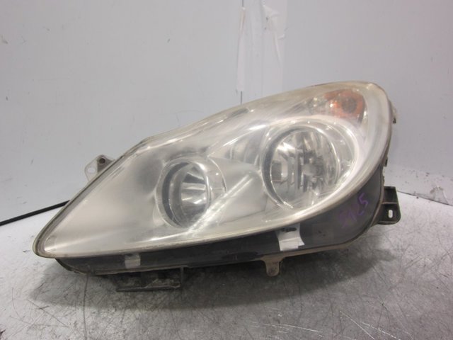 Reflektor lewy 13186381 OPEL