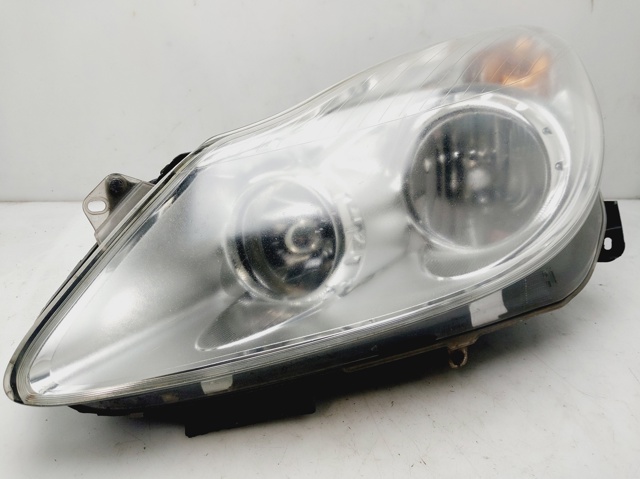 Reflektor lewy 13186381 OPEL