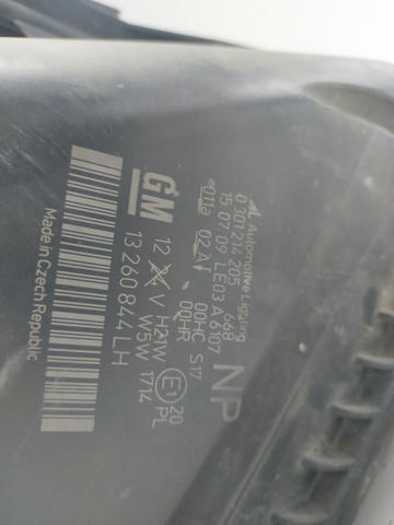 Reflektor lewy 13260844 OPEL