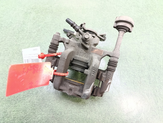 Zacisk hamulcowy tylny lewy 13300861 OPEL