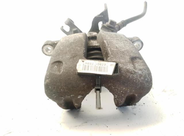 Zacisk hamulcowy tylny lewy 13390033 OPEL