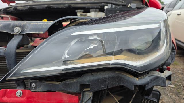 Reflektor lewy 13488969 OPEL