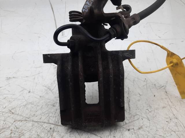 Zacisk hamulcowy tylny lewy 1K0615423J VAG