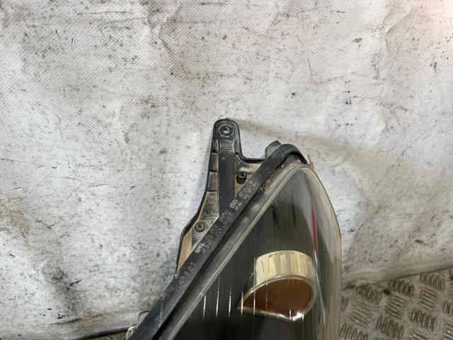 Reflektor lewy 24451032 OPEL