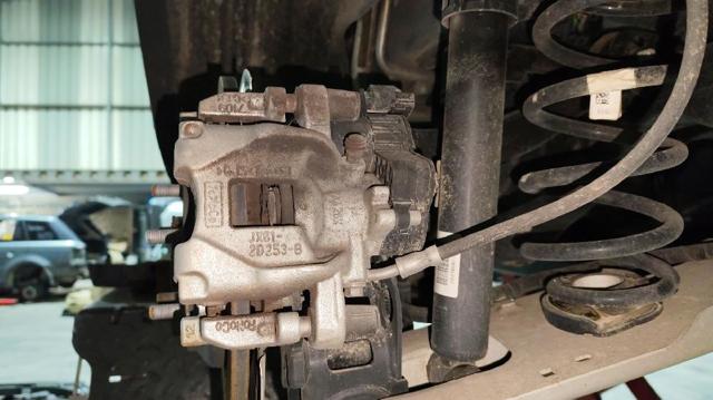 Zacisk hamulcowy tylny lewy Ford Focus 4 HP