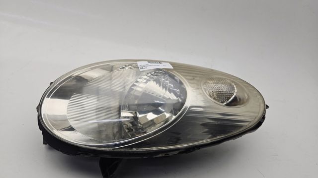 Reflektor lewy 26060AX700 NISSAN
