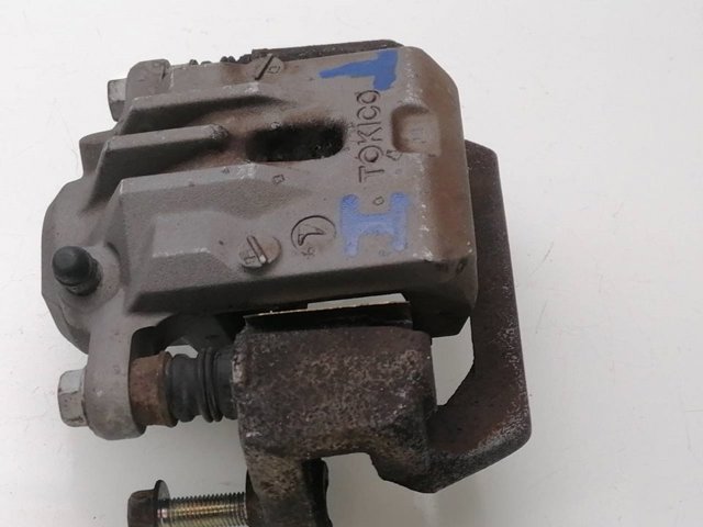 Zacisk hamulcowy tylny lewy 26692AJ010 SUBARU