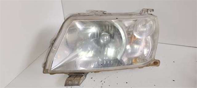 Reflektor lewy 3352065J11 SUZUKI