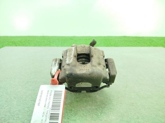 Zacisk hamulcowy tylny prawy 34216750162 BMW