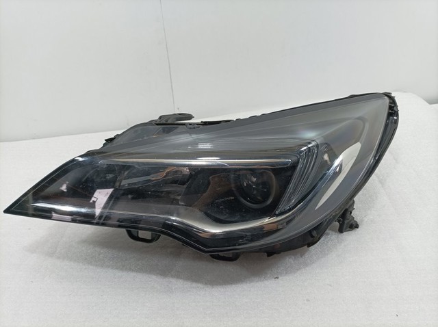 Reflektor lewy 39047198 OPEL
