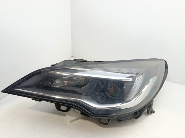 Reflektor lewy 39047198 OPEL