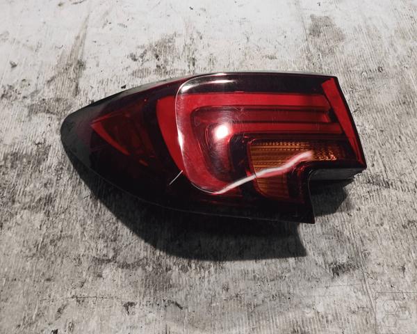 Lampa zespolona tylna lewa zewnętrzna 39099016 OPEL