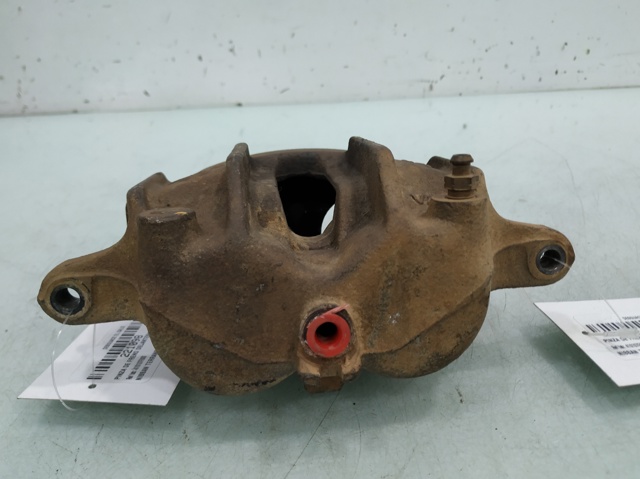Zacisk hamulcowy przedni lewy 410107F000 NISSAN