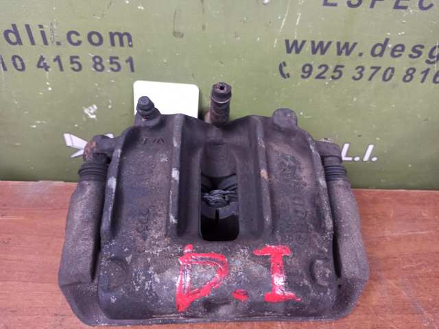 Zacisk hamulcowy przedni lewy 410107F000 NISSAN