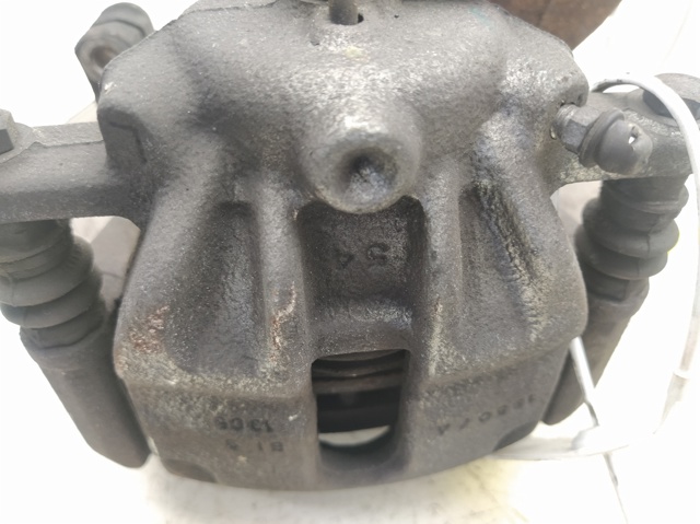 Zacisk hamulcowy przedni lewy 410111HA0B NISSAN