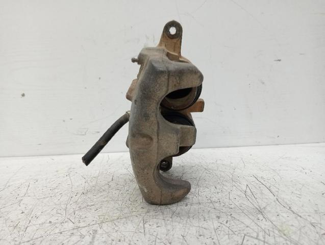 Zacisk hamulcowy przedni lewy 411127F025 NISSAN