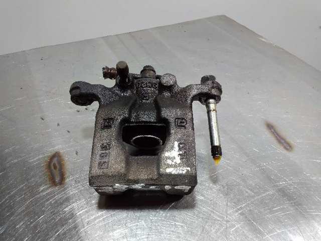 Zacisk hamulcowy tylny lewy 440111KD0A NISSAN