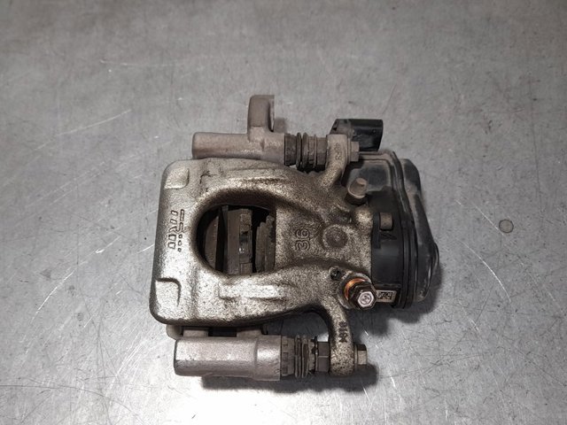 Zacisk hamulcowy tylny lewy 440114EA0A NISSAN