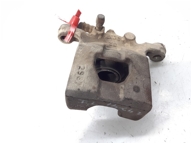 Zacisk hamulcowy tylny lewy 44011EM11A NISSAN