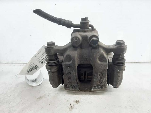 Zacisk hamulcowy tylny prawy KIA Sportage 4 QL