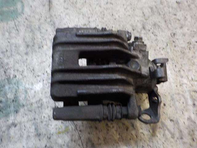 Zacisk hamulcowy tylny lewy 6R0615423 VAG
