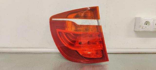 Lampa zespolona tylna lewa zewnętrzna 7217311 BMW