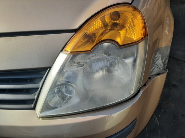 Reflektor lewy 7701058174 RENAULT