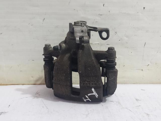 Zacisk hamulcowy tylny lewy 7H0615423A VAG