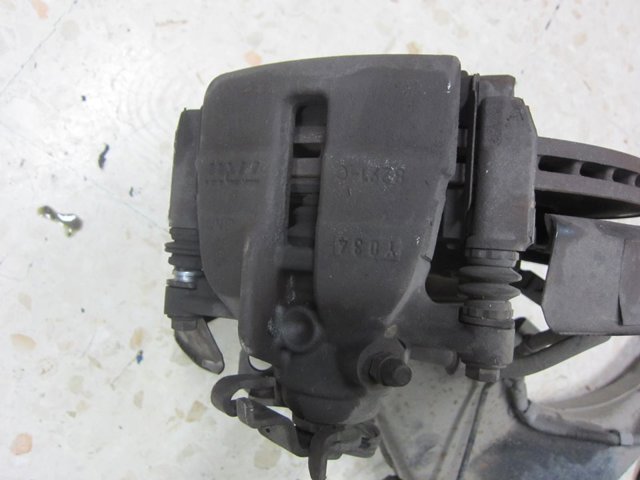 Zacisk hamulcowy tylny lewy 7H0615423A VAG