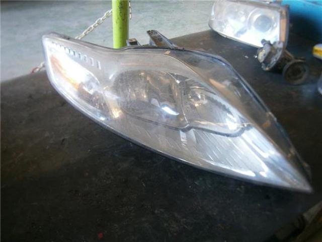 Reflektor prawy 7S7113100AD FORD