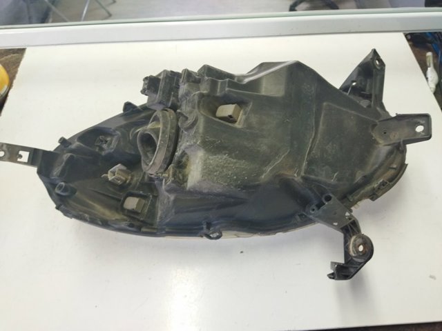 Reflektor lewy 89007101 NISSAN